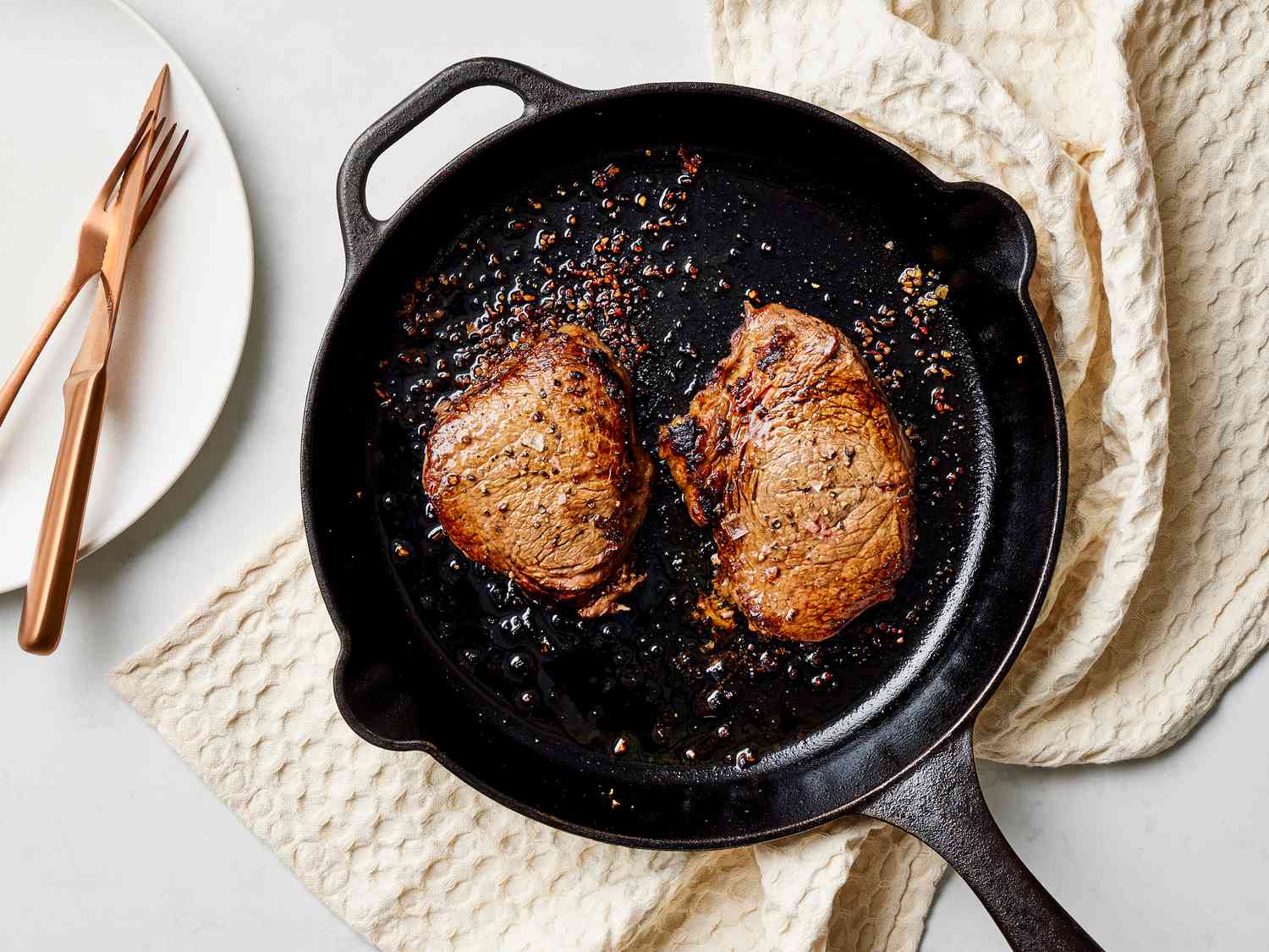 Cast iron pan with cooked steak
